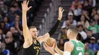 Golden State Warriors center Kristaps Porzingis (7) guards Boston Celtics center Nikola Vucevic (4) during the third quarter at Chase Center.