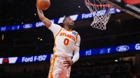 Atlanta Hawks forward Jonathan Kuminga (0) dunks against the Portland Trail Blazers in the fourth quarter at State Farm Arena.