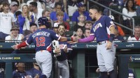 United States designated hitter Kyle Schwarber (12) celebrates with right fielder Aaron Judge (99) after scoring during the third inning against Brazil at Daikin Park.