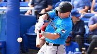 Florida Marlins left fielder Kyle Stowers (28) hits a single in the first inning against the Toronto Blue Jays during spring training at TD Ballpark.