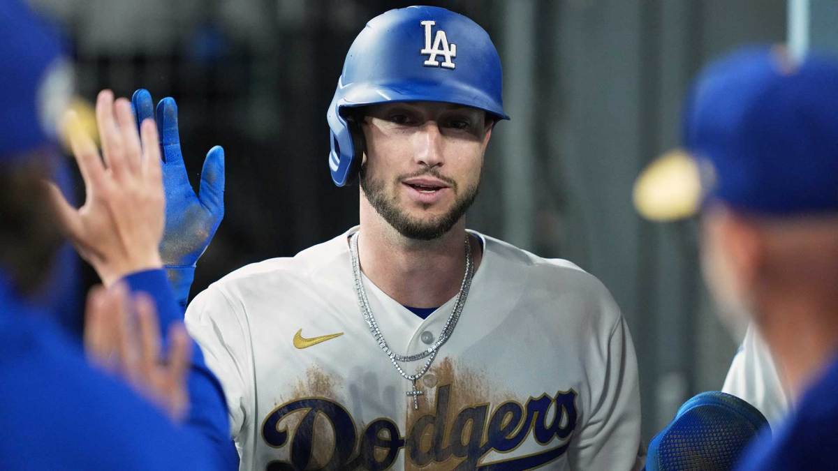 Dodgers outfielder Kyle Tucker (23) shakes hands