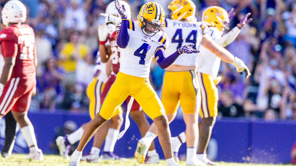 LSU Tigers cornerback Mansoor Delane (4) reacts to a stop on fourth down against the Arkansas Razorbacks during the second half at Tiger Stadium.