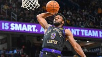 Los Angeles Lakers guard Bronny James (9) dunks the ball against the Washington Wizards during the second half at Capital One Arena