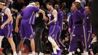 Los Angeles Lakers guard Luka Doncic (77) celebrates scoring a basket against the Houston Rockets in the second half at Toyota Center.