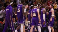 Lakers forward LeBron James (23) celebrates guard Luka Doncic (77)