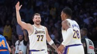 Lakers guard Luka Doncic (77) celebrates