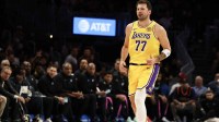 Los Angeles Lakers guard Luka Doncic (77) reacts after point against Miami Heat at Kaseya Center.