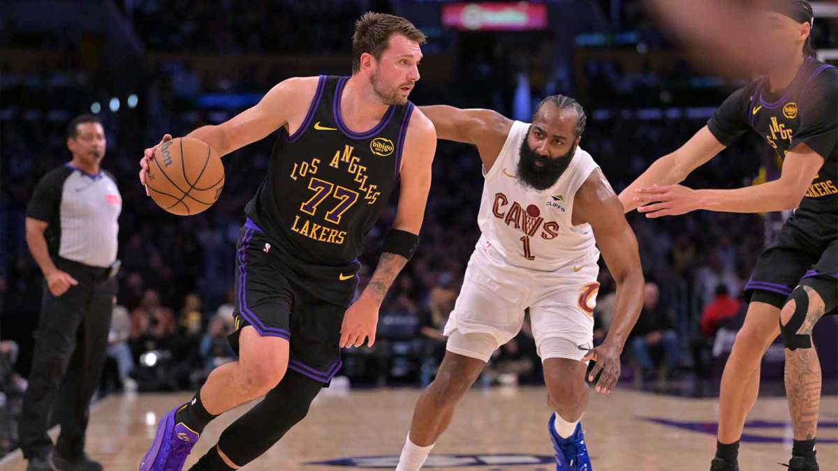 Los Angeles Lakers guard Luka Doncic (77) is defended by Cleveland Cavaliers guard James Harden (1) as he drives to the basket in the first half at Crypto.com Arena.