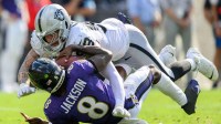 Las Vegas Raiders defensive end Maxx Crosby (98) sacks Baltimore Ravens quarterback Lamar Jackson (8) during the second half at M&T Bank Stadium. Mandatory Credit: Reggie Hildred-Imagn Images