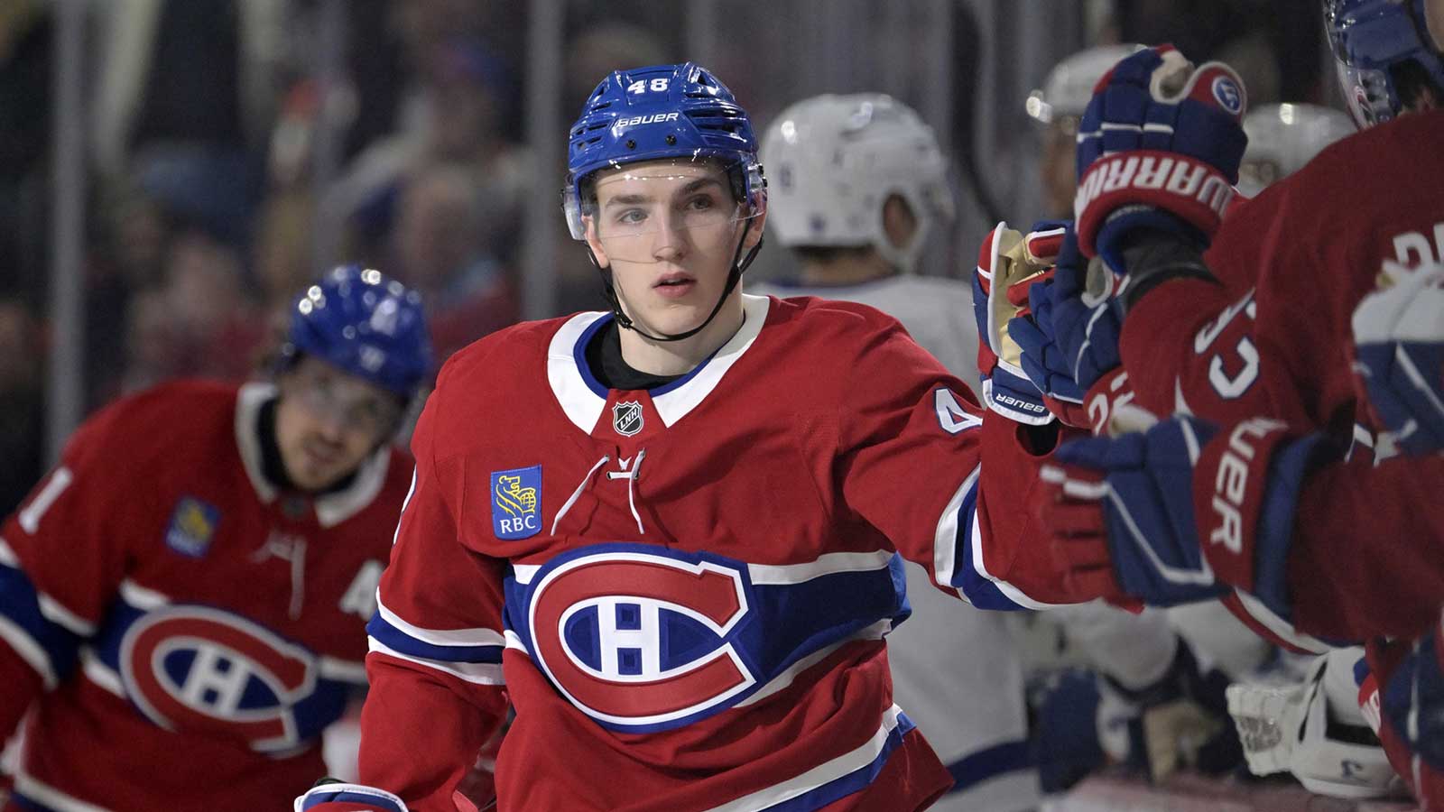 Montreal Canadiens defenseman Lane Hutson (48) celebrates with teammates after scoring a goal against the Toronto Maple Leafs during the first period at the Bell Centre.