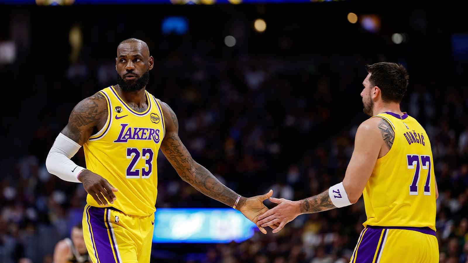 Los Angeles Lakers forward LeBron James (23) and guard Luka Doncic (77) in the first quarter against the Denver Nuggets at Ball Arena.