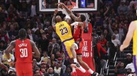 Los Angeles Lakers forward LeBron James (23) attempts to dunk the ball as Houston Rockets forward Jabari Smith Jr. (10) defends during the first quarter at Toyota Center.