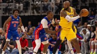 Detroit Pistons Javonte Green (31) defends against Los Angeles Lakers LeBron James (23) during the second half at Little Caesars Arena.