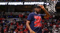 Arizona Wildcats guard Bryce James (6) holds up a piece of the net after an Elite Eight game against the Purdue Boilermakers of the West Regional of the men's 2026 NCAA Tournament at SAP Center.