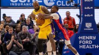 Detroit Pistons Javonte Green (31) defends against Los Angeles Lakers LeBron James (23) during the second half at Little Caesars Arena.