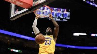 Los Angeles Lakers forward LeBron James (23) dunks against the Miami Heat during the first half at Kaseya Center.