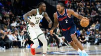 Los Angeles Clippers forward Kawhi Leonard (2) drives the ball while under pressure from Milwaukee Bucks forward Taurean Prince (12) during the first half at Intuit Dome.