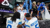 Detroit Lions running backs Jahmyr Gibbs and David Montgomery sign autographs for Lions fans after the 38-30 win over the Baltimore Ravens at M&T Bank Stadium in Baltimore on Monday, Sept. 22, 2025.