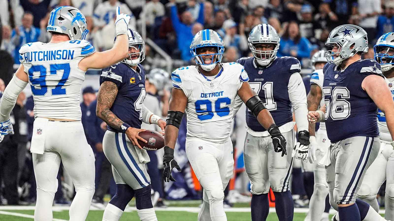 Detroit Lions linebacker Al-Quadin Muhammad (96) celebrates a sack of Dallas Cowboys quarterback Dak Prescott (4) during the second half at Ford Field in Detroit on Thursday, Dec. 4, 2025.