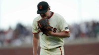San Francisco Giants pitcher Logan Webb (62) yells into his glove after the Giants recorded the final out of the fifth inning against the New York Yankees at Oracle Park.