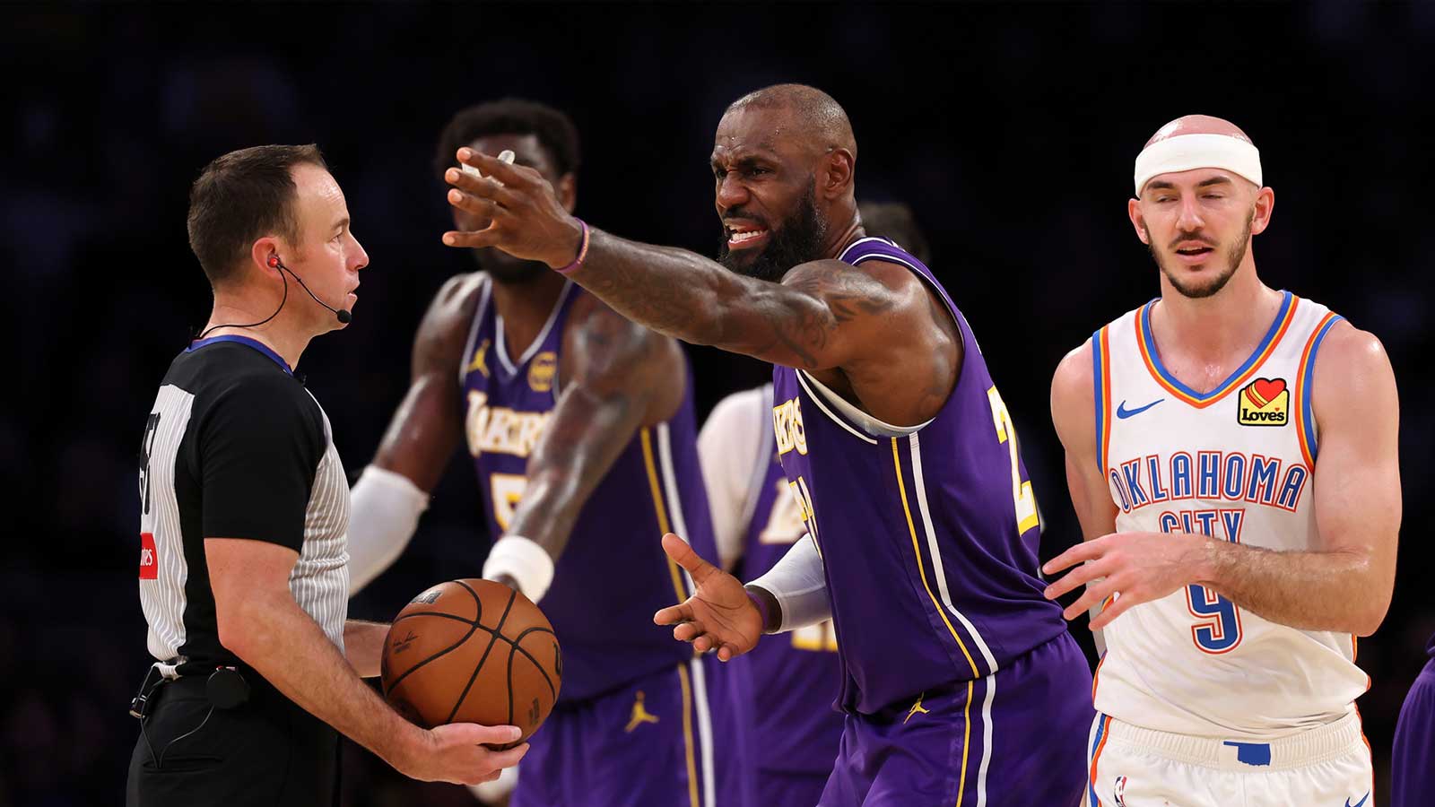 Los Angeles Lakers forward LeBron James (23) argues with referee Josh Tiven (58) during the fourth quarter against the Oklahoma City Thunder at Crypto.com Arena. Mandatory Credit: Kiyoshi Mio-Imagn Images
