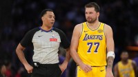 Los Angeles Lakers guard Luka Doncic (77) talks with referee Karl Lane (77) against the Indiana Pacers in the second half at Crypto.com Arena.