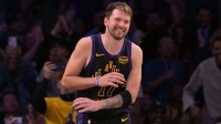 Los Angeles Lakers guard Luka Doncic (77) smiles after a dunk in the final minutes of the game against the Cleveland Cavaliers at Crypto.com Arena.