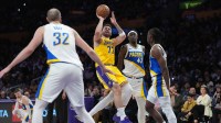 Los Angeles Lakers guard Luka Doncic (77) shoots the ball against Indiana Pacers forward Pascal Siakam (43), center Jay Huff (32) and guard Aaron Nesmith (23) in the first half at Crypto.com Arena. Mandatory Credit: Kirby Lee-Imagn Images