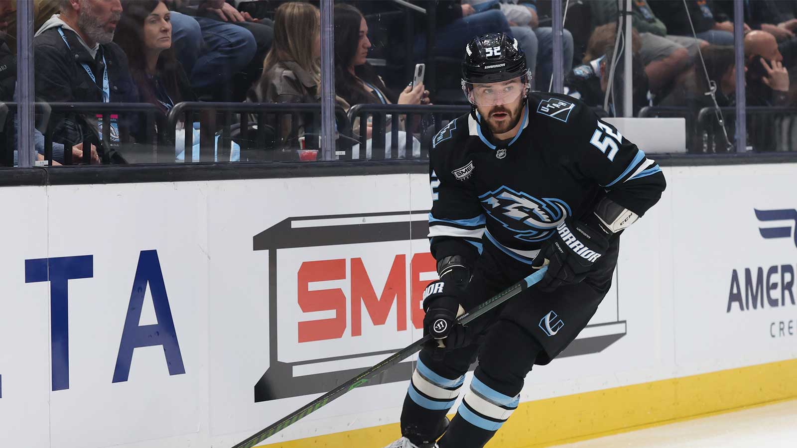 Utah Mammoth defenseman Mackenzie Weegar (52) skates with the puck against the Chicago Blackhawks during the first period at Delta Center.