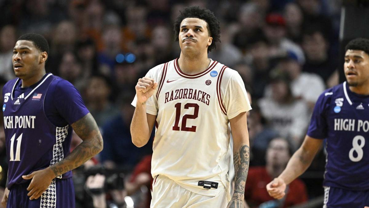 Arkansas Razorbacks forward Malique Ewin (12) reacts after a play in the second half against the High Point Panthers during a second round game of the men's 2026 NCAA Tournament at Moda Center.