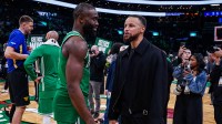 Mar 18, 2026; Boston, Massachusetts, USA; Boston Celtics guard Jaylen Brown (7) talks with Golden State Warriors guard Stephen Curry (30) after the game at TD Garden. Mandatory Credit: David Butler II-Imagn Images