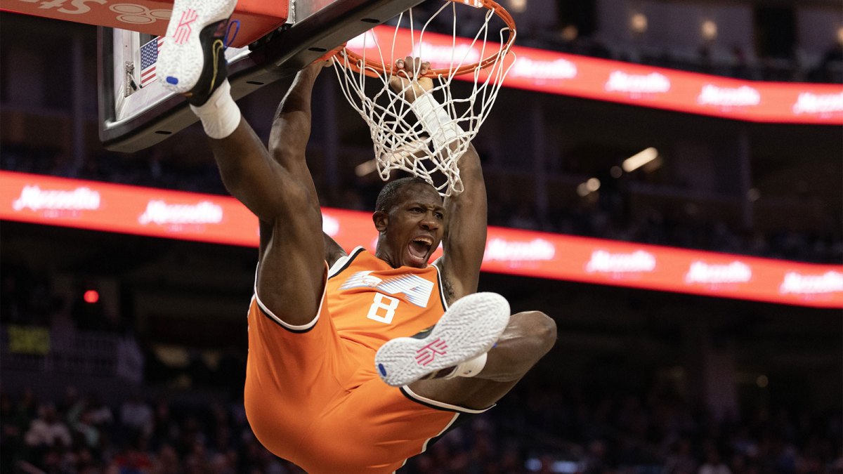 Mar 2, 2026; San Francisco, California, USA; Los Angeles Clippers guard Kris Dunn (8) hangs on the rim after dunking against the Golden State Warriors during the third quarter at Chase Center. Mandatory Credit: D. Ross Cameron-Imagn Images