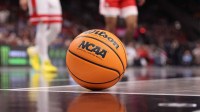 A basketball sits on the court during the second half of a game between the Arizona Wildcats and the Houston Cougars during the men's Big 12 Conference Tournament Championship at T-Mobile Center.