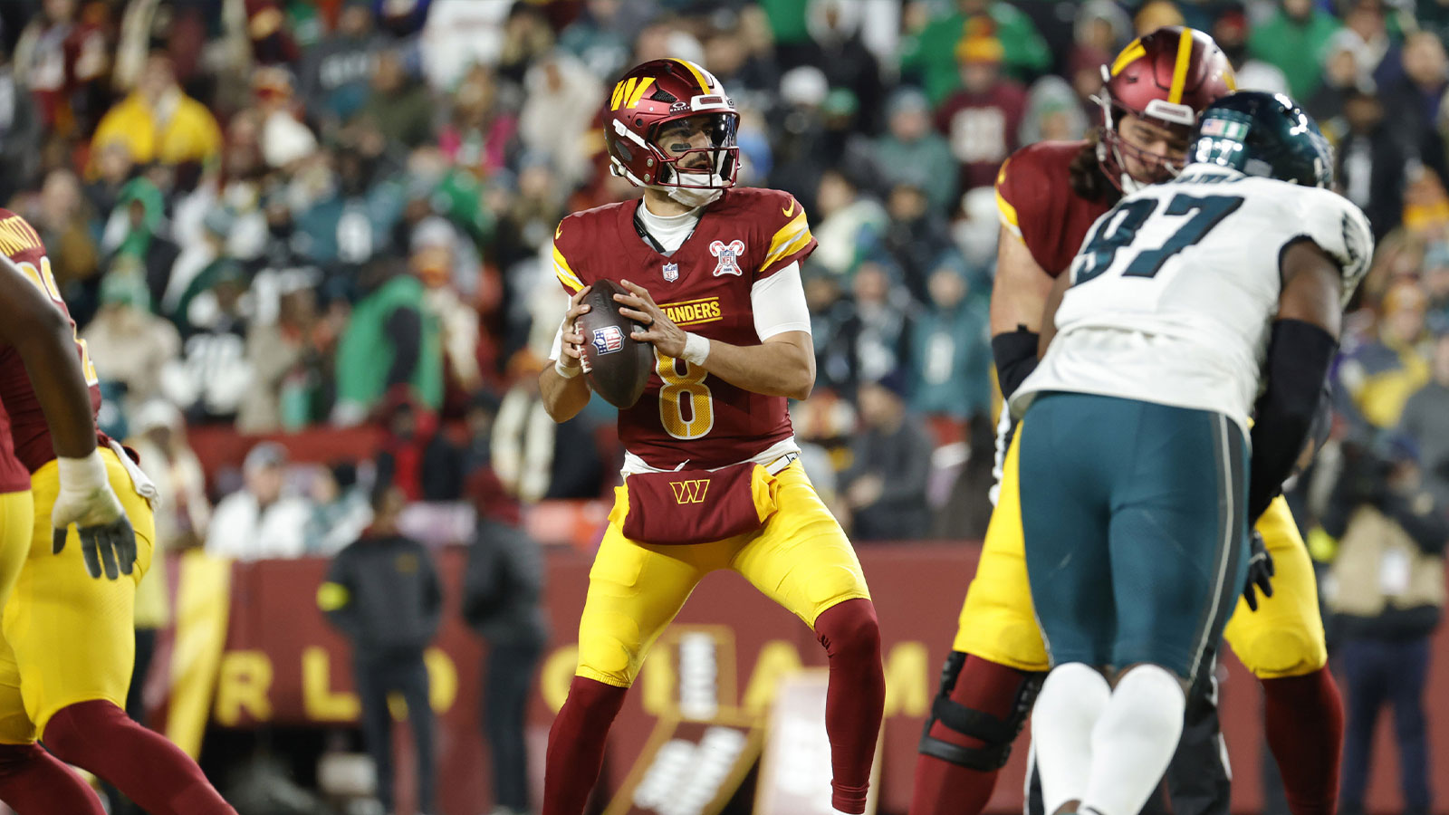 Washington Commanders quarterback Marcus Mariota (8) prepares to throw the ball against the Philadelphia Eagles during the second half at Northwest Stadium. 