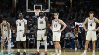Gonzaga Bulldogs guard Jalen Warley (8), forward Emmanuel Innocenti (5), forward Graham Ike (15), guard Mario Saint-Supery (17) and guard Davis Fogle (4) wait for a review during the second half of a first round game of the men's 2026 NCAA Tournament against the Kennesaw State Owls at Moda Center.