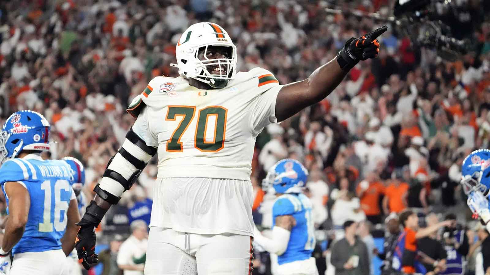 Miami (FL) Hurricanes offensive lineman Markel Bell (70) celebrates after going up 31-27 against the Mississippi Rebels late in the fourth quarter during the Vrbo Fiesta Bowl and CFP semifinal game at State Farm Stadium on Jan. 8, 2026, in Glendale.