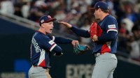 United States center fielder Pete Crow-Armstrong (4) and United States pitcher Mason Miller (19) celebrate after defeating the Dominican Republic in a semifinal game of the 2026 World Baseball Classic at loanDepot Park.
