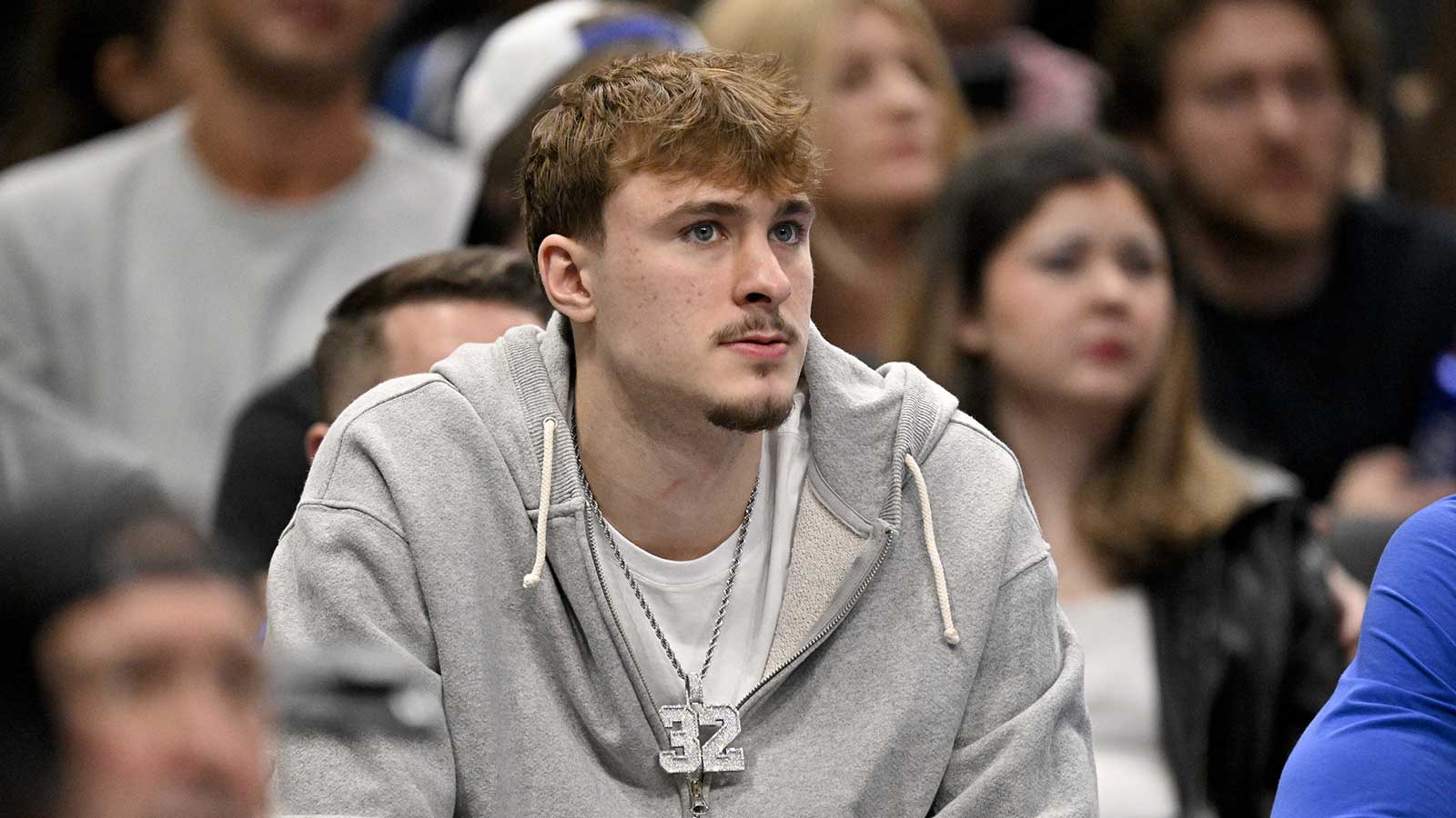Mavericks forward Cooper Flagg looks on from the team bench during the second half against the Memphis Grizzlies at the American Airlines Center