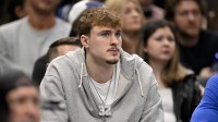Mavericks forward Cooper Flagg looks on from the team bench during the second half against the Memphis Grizzlies at the American Airlines Center