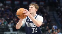 Mavericks forward Cooper Flagg (32) shoots during the second half against the Cleveland Cavaliers at American Airlines Center with Marc Stein in the background