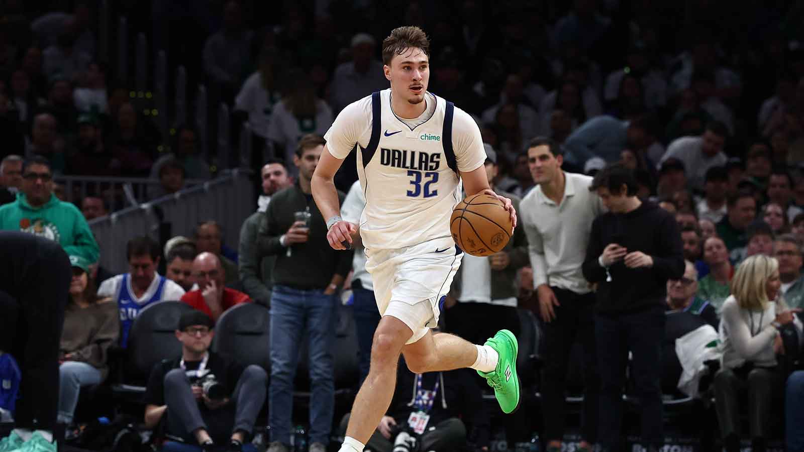 Dallas Mavericks forward Cooper Flagg (32) brings the ball up the court against the Boston Celtics during the second half at TD Garden.