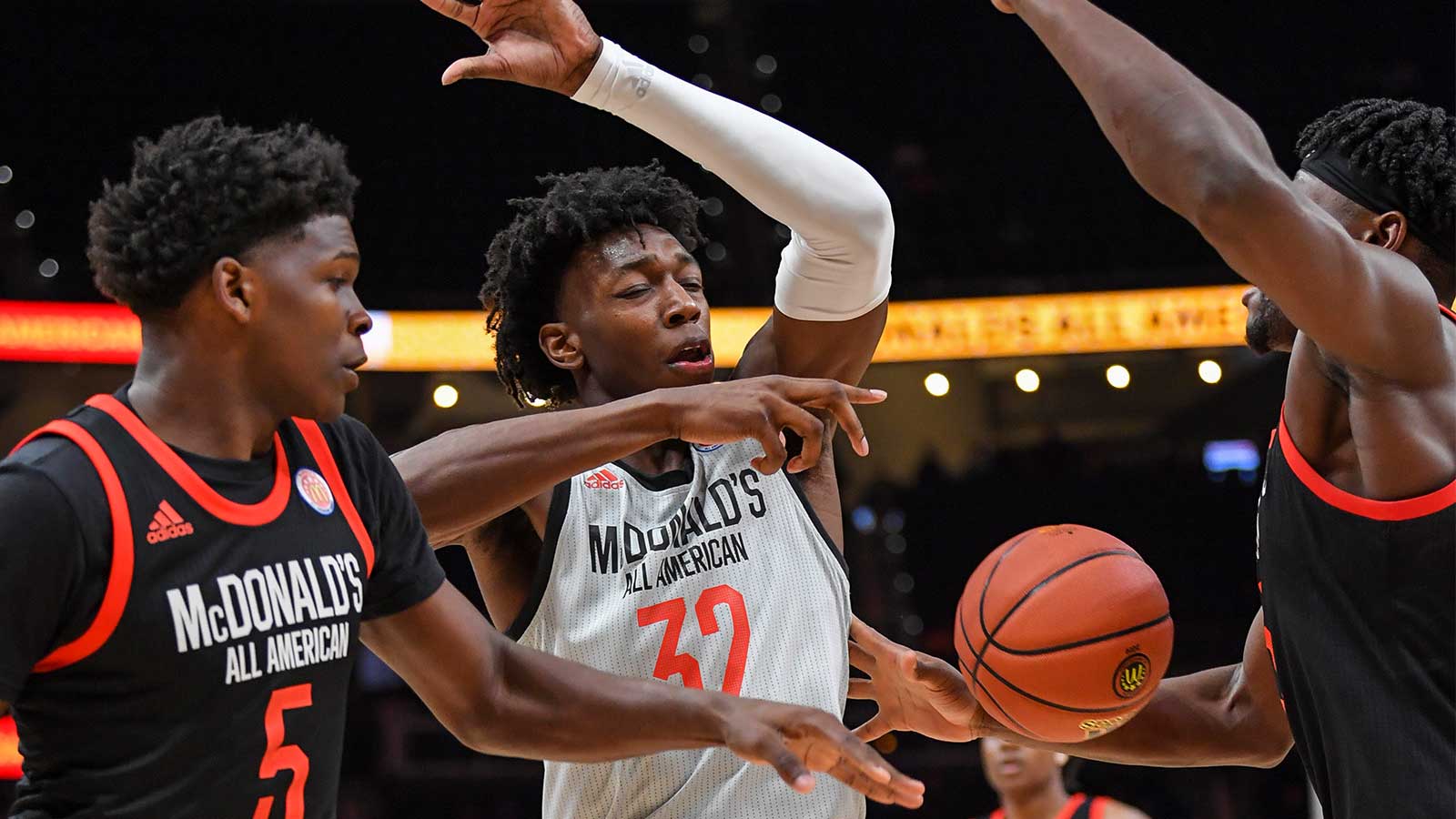 East Team's Anthony Edwards (5) takes the ball away from West Team's Tre Mann (32) during the second half at State Farm Arena.
