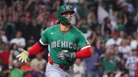 Mexico outfielder Jarren Duran (16) hits a home run