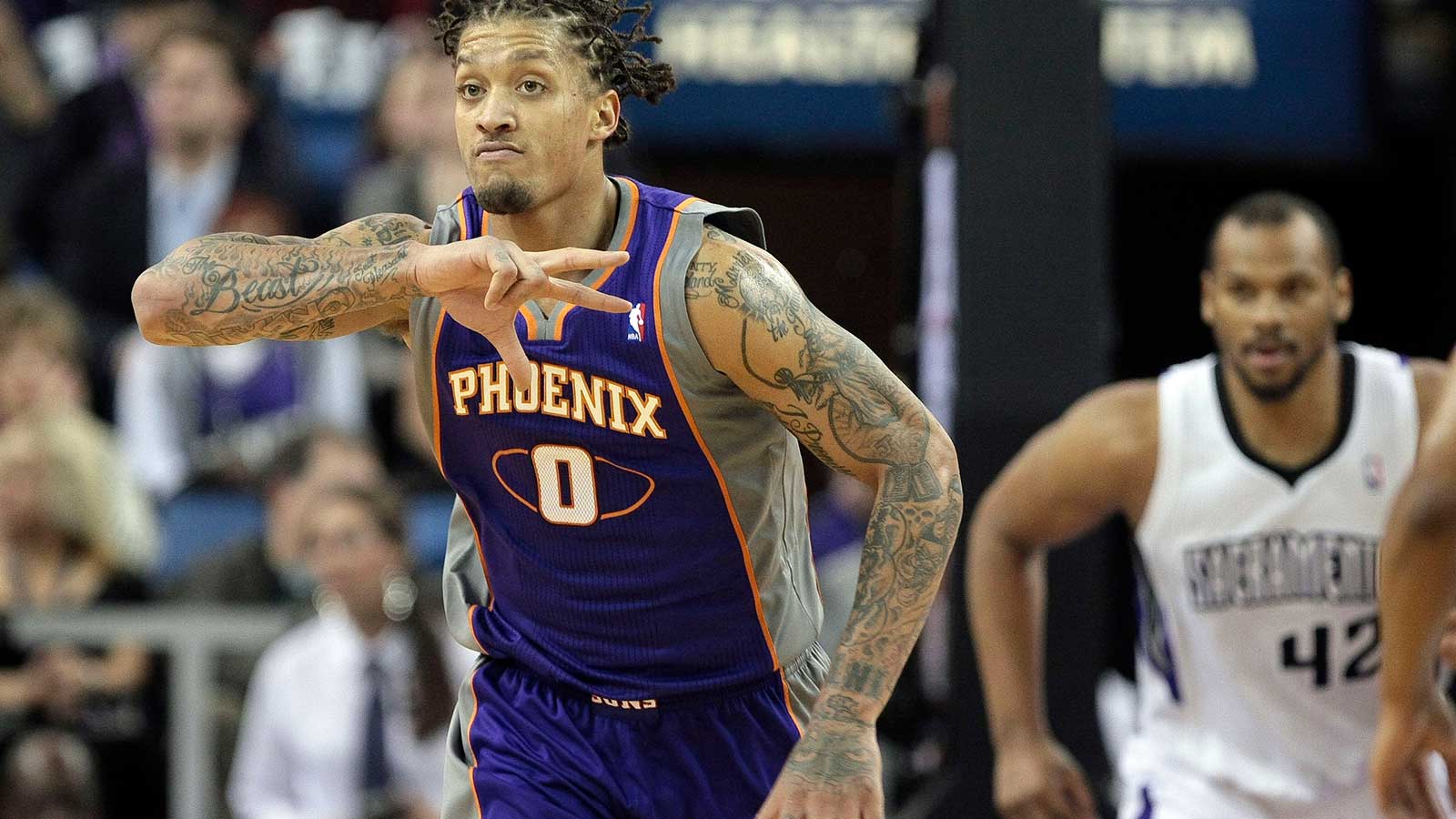 Phoenix Suns small forward Michael Beasley (0) celebrates after scoring against the Sacramento Kings during the fourth quarter at Sleep Train Arena. The Phoenix Suns defeated the Sacramento Kings 106-96. 