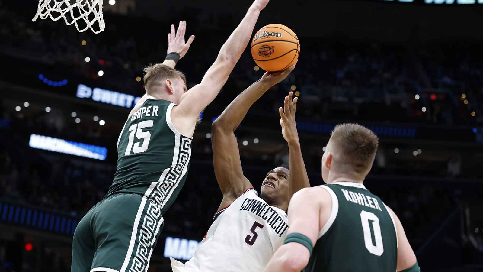 UConn Huskies forward Tarris Reed Jr. (5) shoots the ball against Michigan State Spartans center Carson Cooper (15) in the second half during a Sweet Sixteen game of the East Regional of the men's 2026 NCAA Tournament at Capital One Arena.