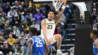 Michigan Wolverines forward Yaxel Lendeborg (23) reacts after a dunk in the first half against the Saint Louis Billikens during a second round game of the men's 2026 NCAA Tournament at Keybank Center.