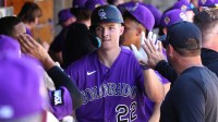 Colorado Rockies right fielder Mickey Moniak (22) celebrates with teammates after hitting a solo home run against the United States in the fourth inning at Salt River Fields.
