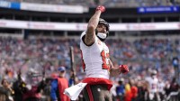 Tampa Bay Buccaneers wide receiver Mike Evans (13) reacts a touchdown during the first half against the Carolina Panthers at Bank of America Stadium.