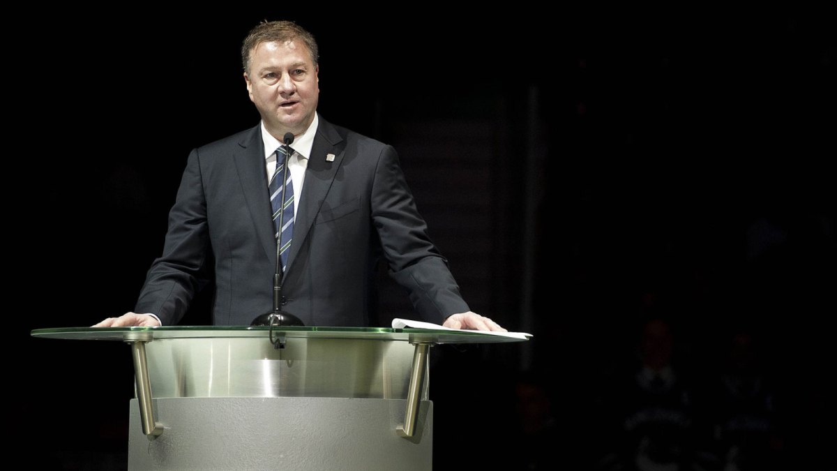 Mike Gillis gives a speech as the Vancouver Canucks host Markus Naslund night to retire his jersey at Rogers Arena