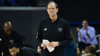Washington Huskies head coach Mike Hopkins watches game action against the UCLA Bruins during the first half at Pauley Pavilion